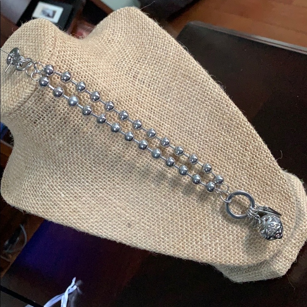 Silver plunder charm bracelet